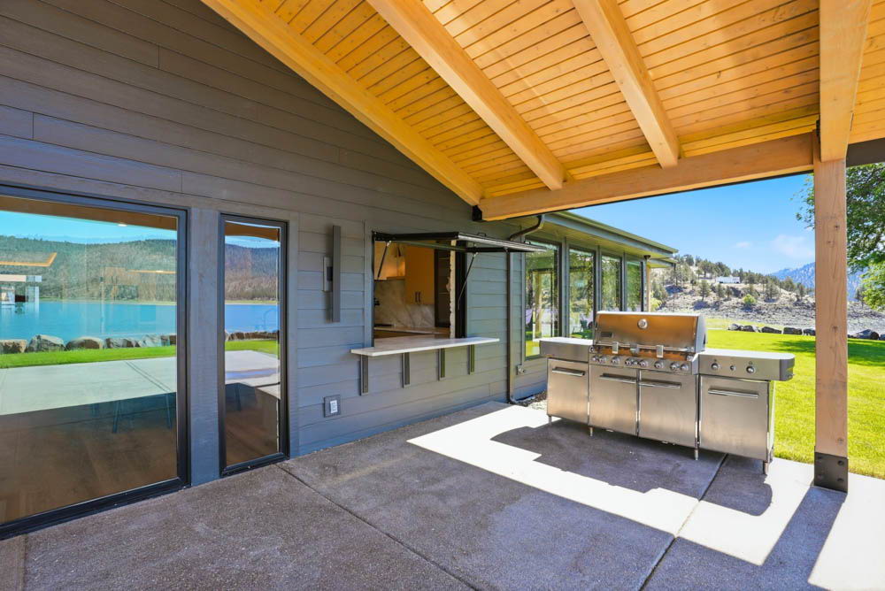 Covered patio with outdoor kitchen pass-through