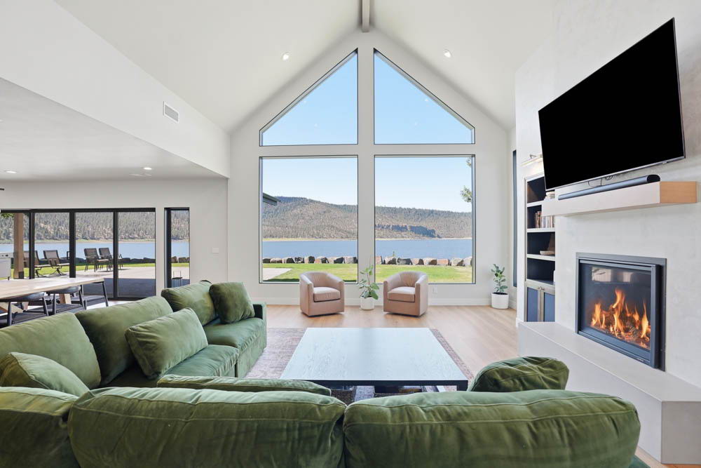 Living room with vaulted ceilings and reservoir view