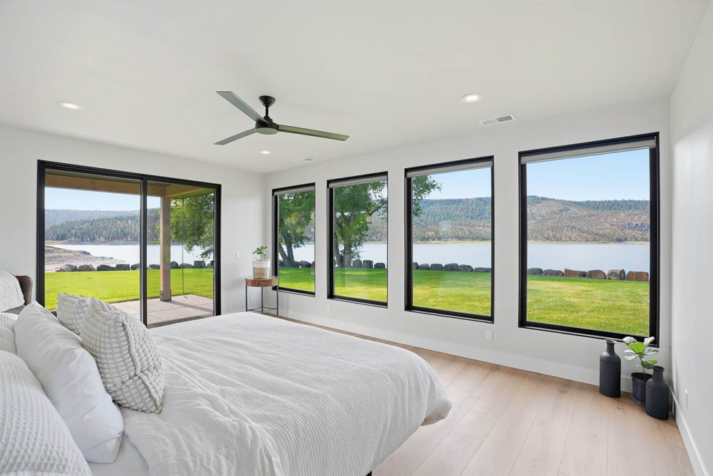 Primary master bedroom with wall of windows